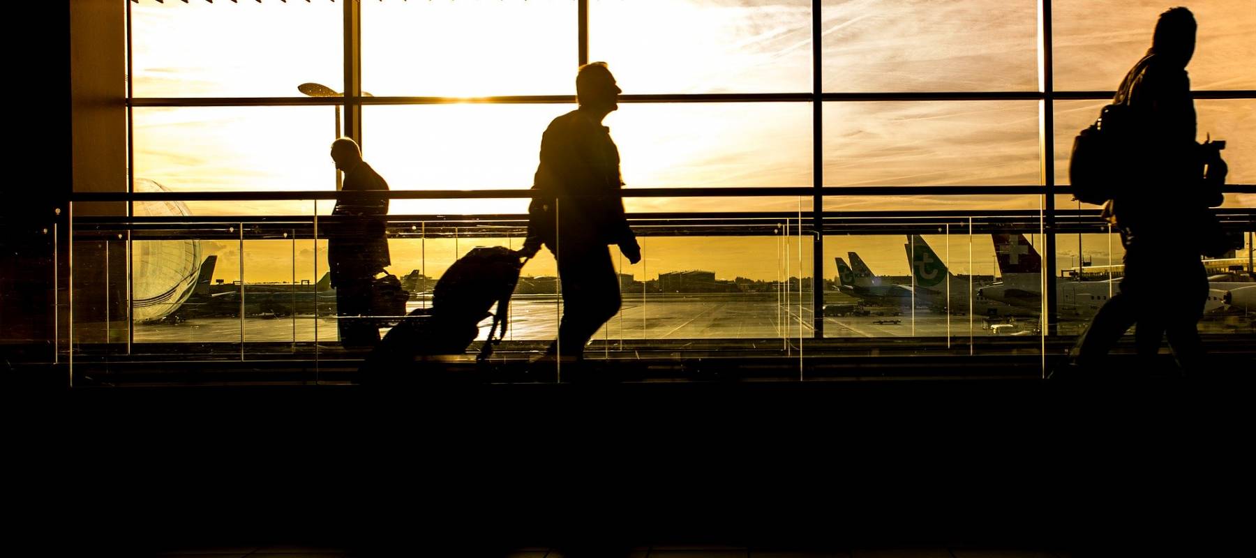 Monitors at an airport listing connecting flights