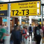 Monitors at an airport listing connecting flights