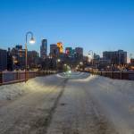 A Wide Cityscape Shot of Minneapolis during a Winter Twilight taken from the Stone Arch Bridge