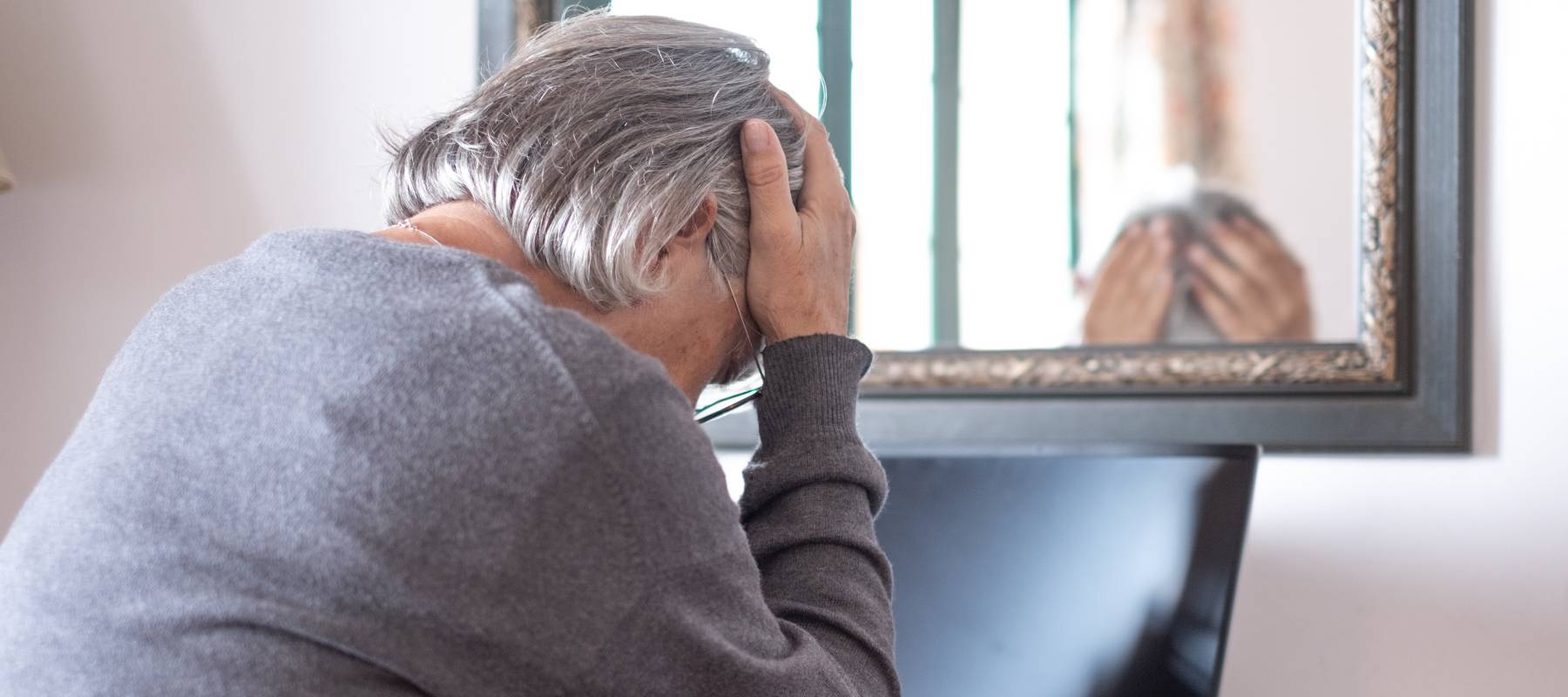 An older adult deals with a potential fraudster.