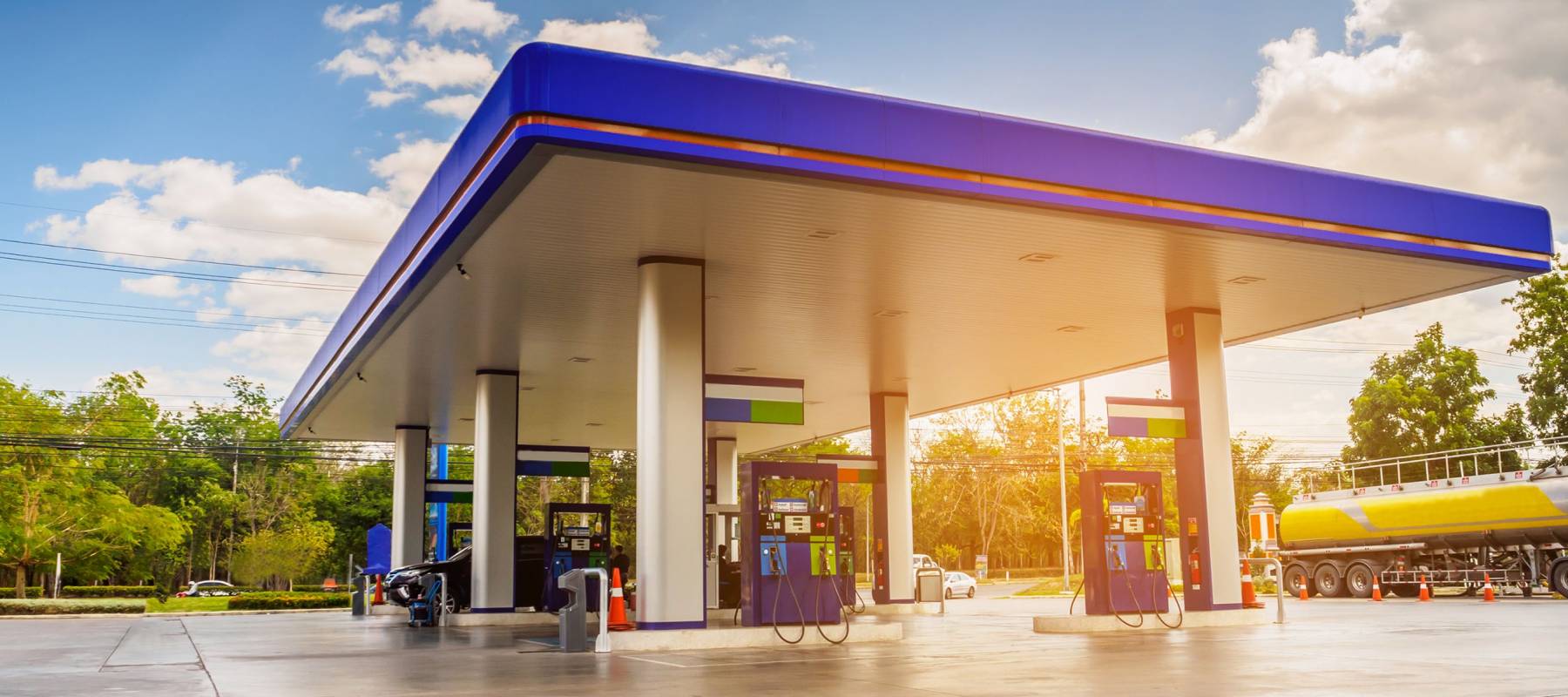 Gas station with clouds sky and sun light