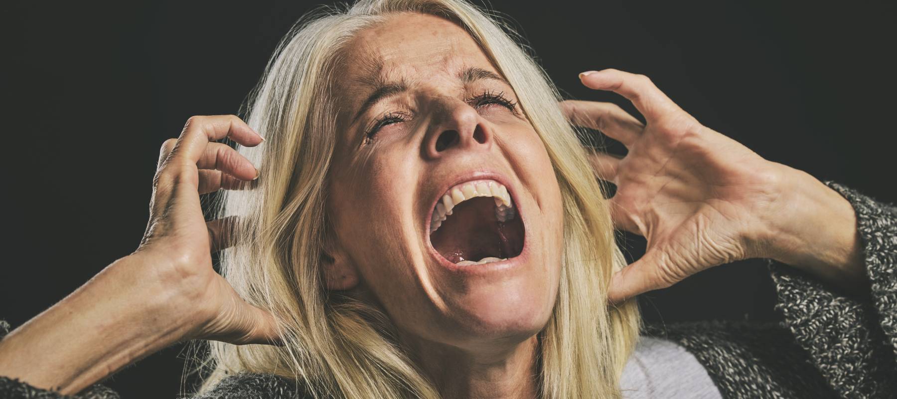 An anxious, older woman.