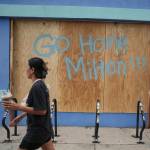 Hurricane Milton message on boarded window in Tampa