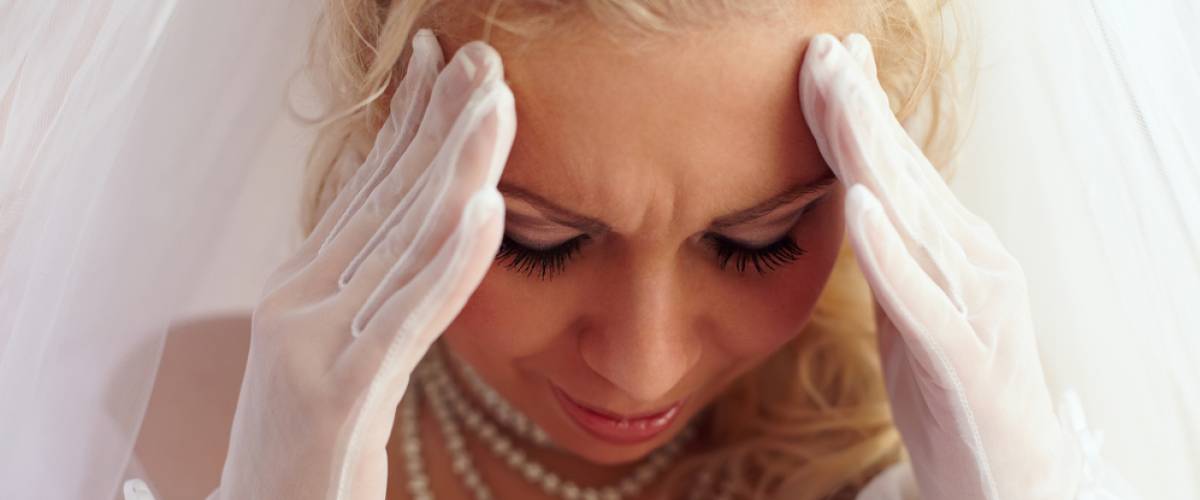 bride head hands sad