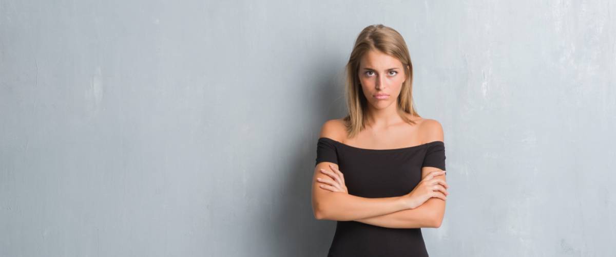 woman alone arms crossed