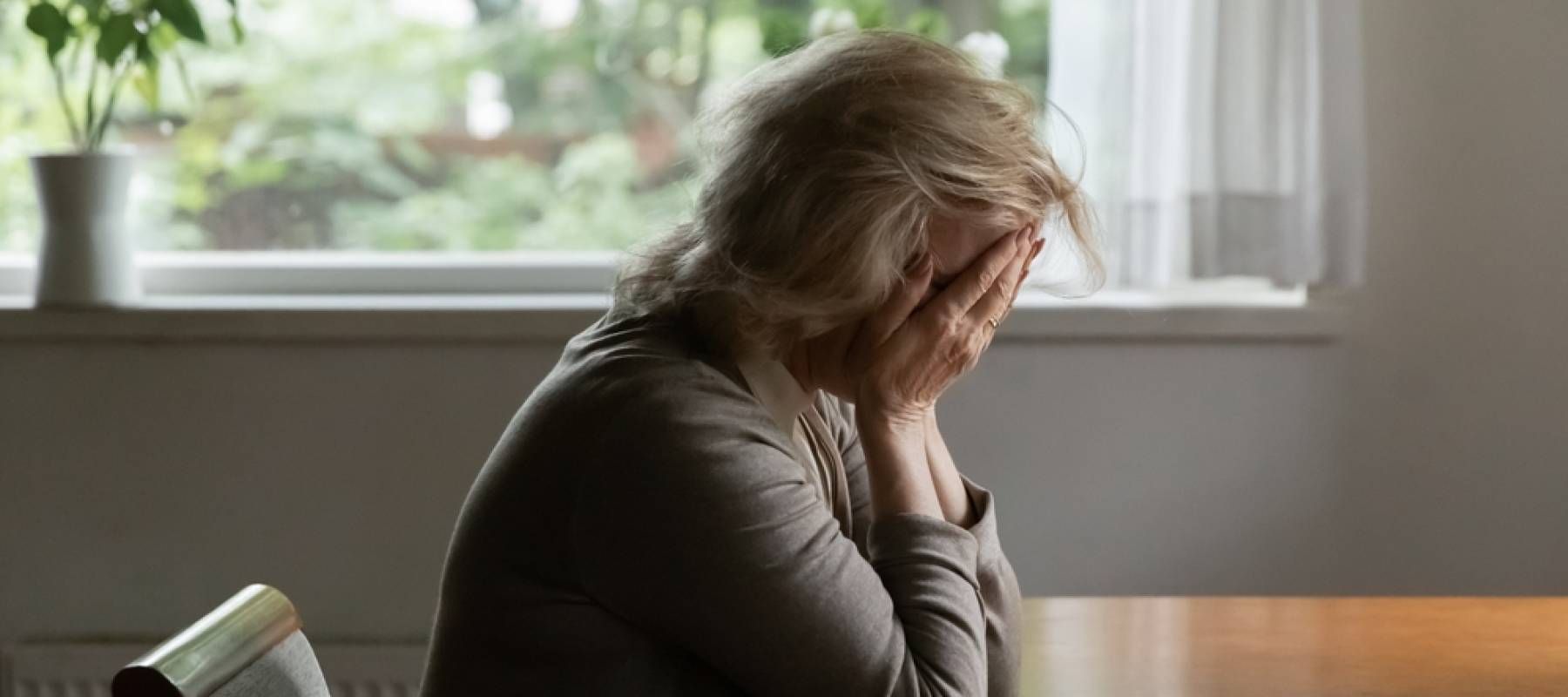 Unhappy old Caucasian woman