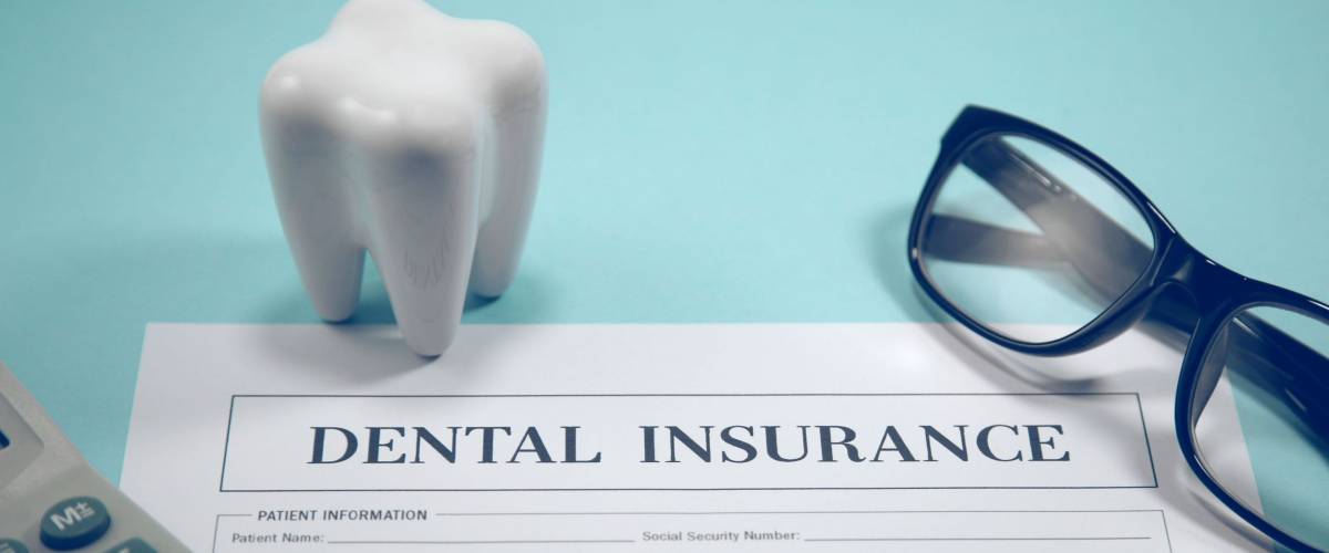 Dental insurance form on the dentist table.