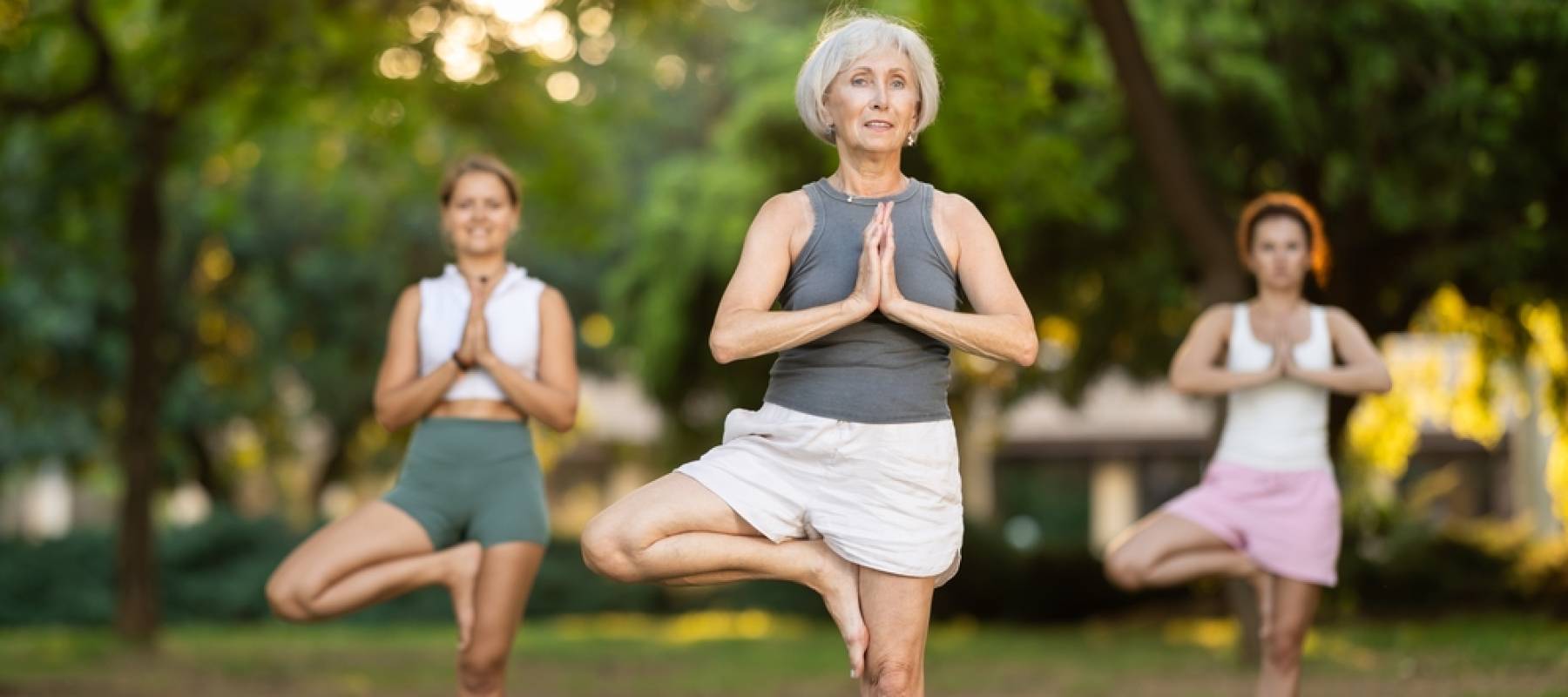 Positive fit senior yogini practicing hatha yoga