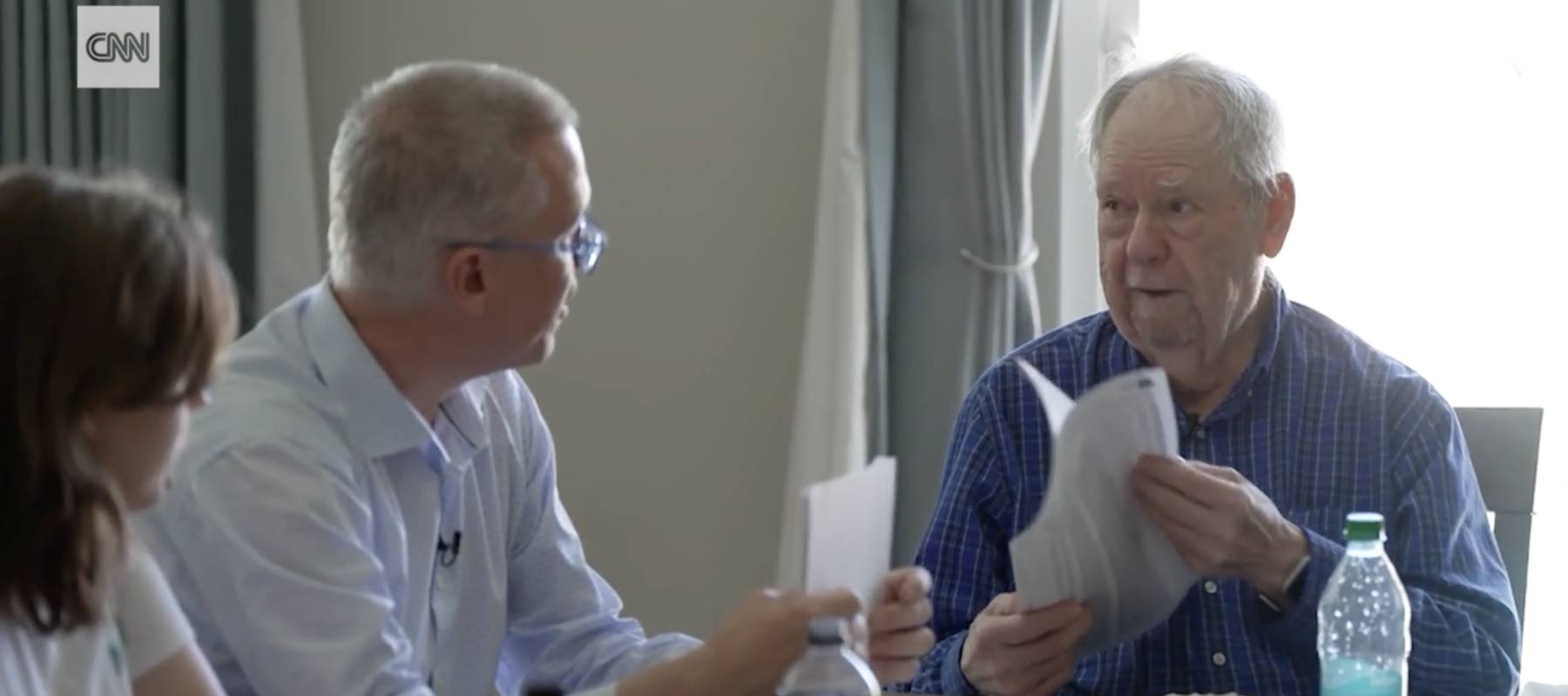 Jason, center, and Richard Benjamin, right go over the elder Benjamin's transactions.