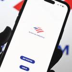 A photo illustration of Bank of America logos displayed on a mobile phone screen and computer screen, Oct. 2, 2024.