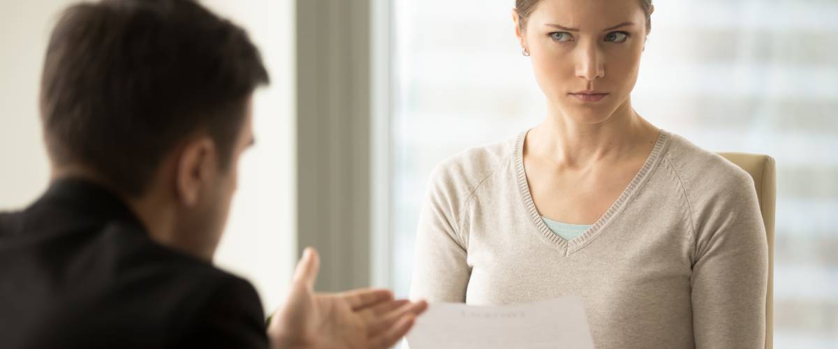 Woman conducting job interview looking annoyed