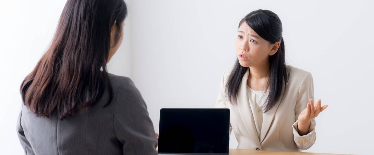 Woman making annoyed expression during job interview