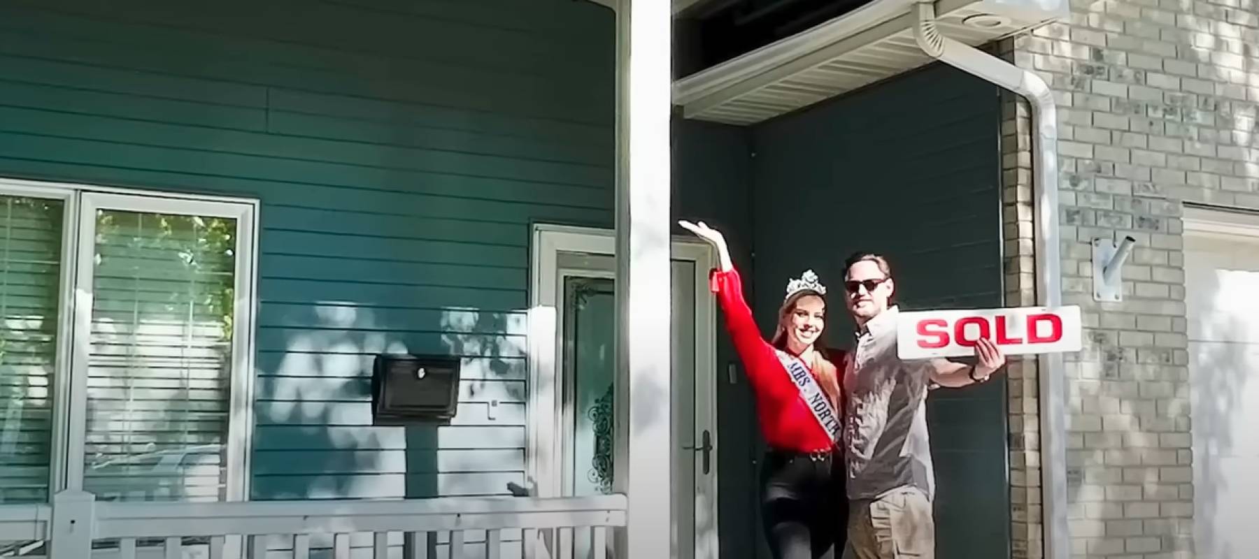 Wes Van Dell and his wife in front of their home