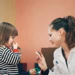 Doctor working with child
