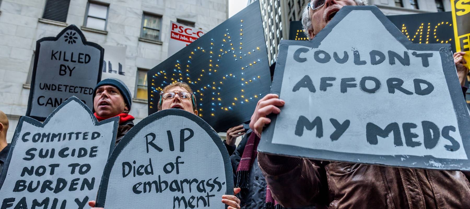 Protesters in New York march against lack of healthcare funding.