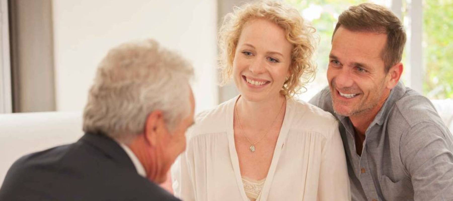 Financial advisor talking with clients