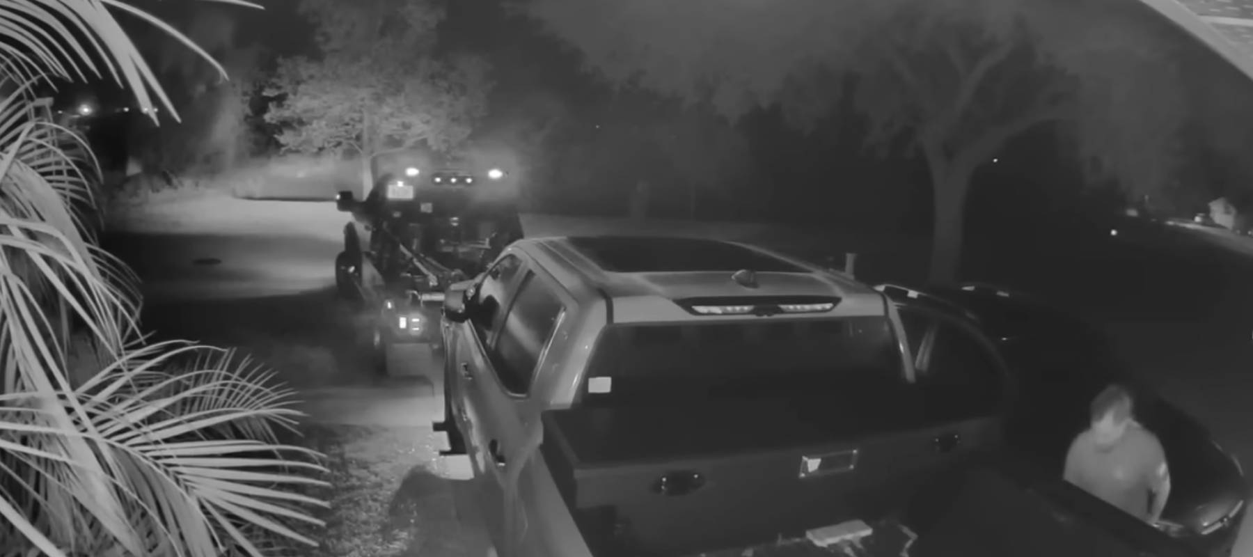 Truck getting towed from driveway