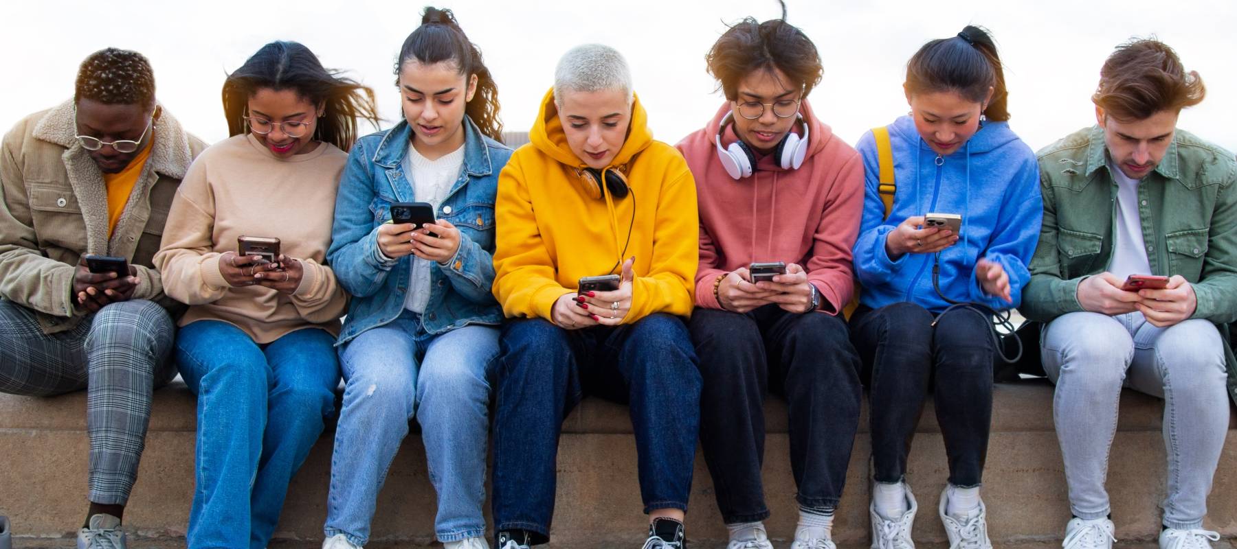 Group of teens on their phones.