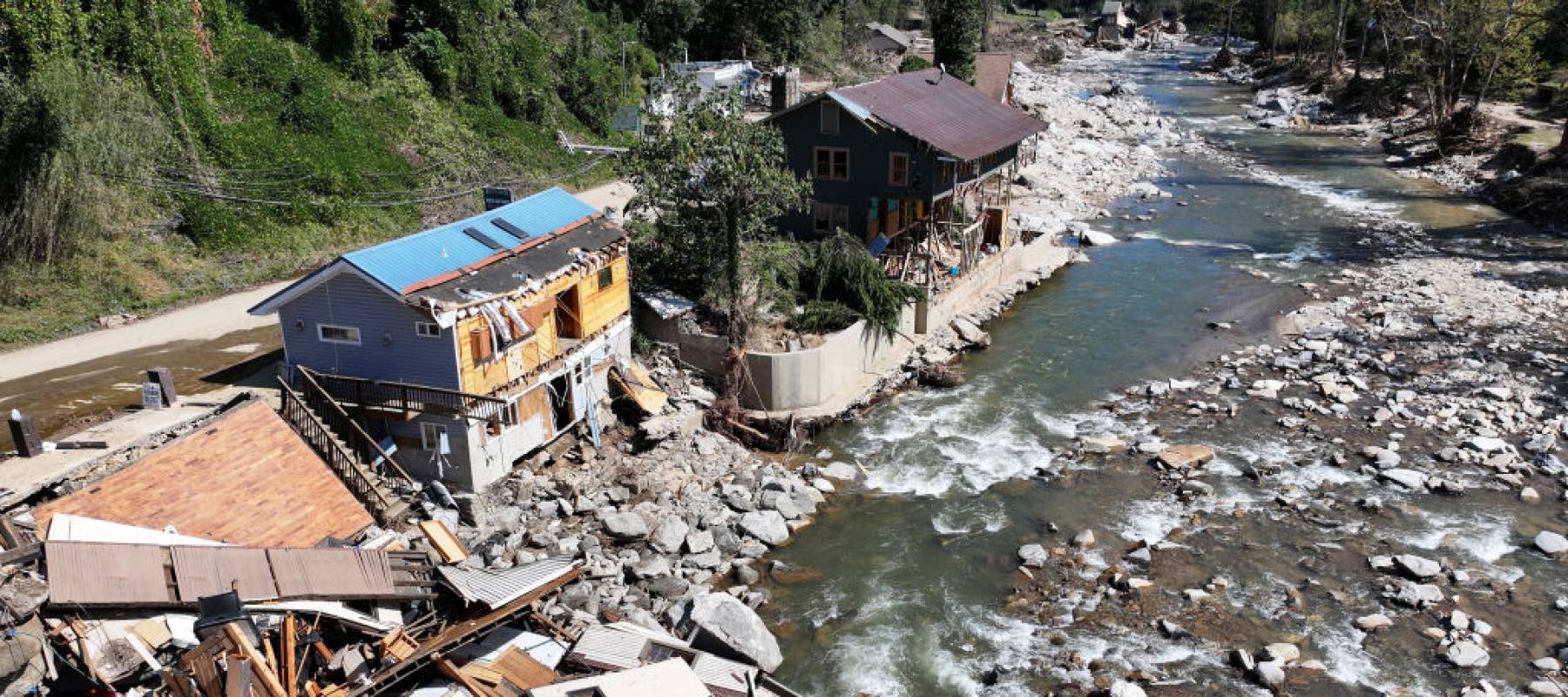 Aerial view of destroyed and damaged buildings in the aftermath of Hurricane Helene flooding on October 8, 2024 in Bat Cave, North Carolina