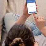 Woman using investment mobile app
