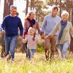 Happy multi-generation family walking in the countryside