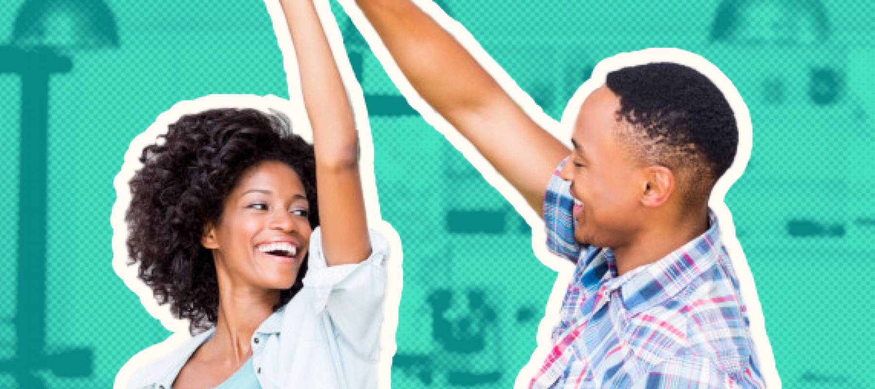 Man and woman holding hands raised in the air and smiling