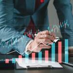 Businessman drawing virtual technical graph and chart for analysis stock market, technology investment and value investment concept.