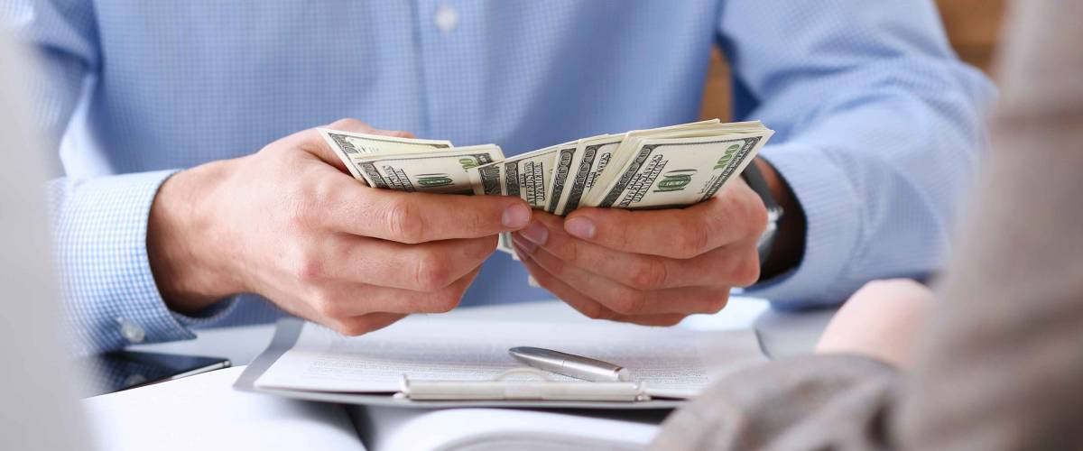 The businessman considers cash dollars in the office issues salaries to employees with black cash divides the profits as a result of illegal transactions everyone is happy.