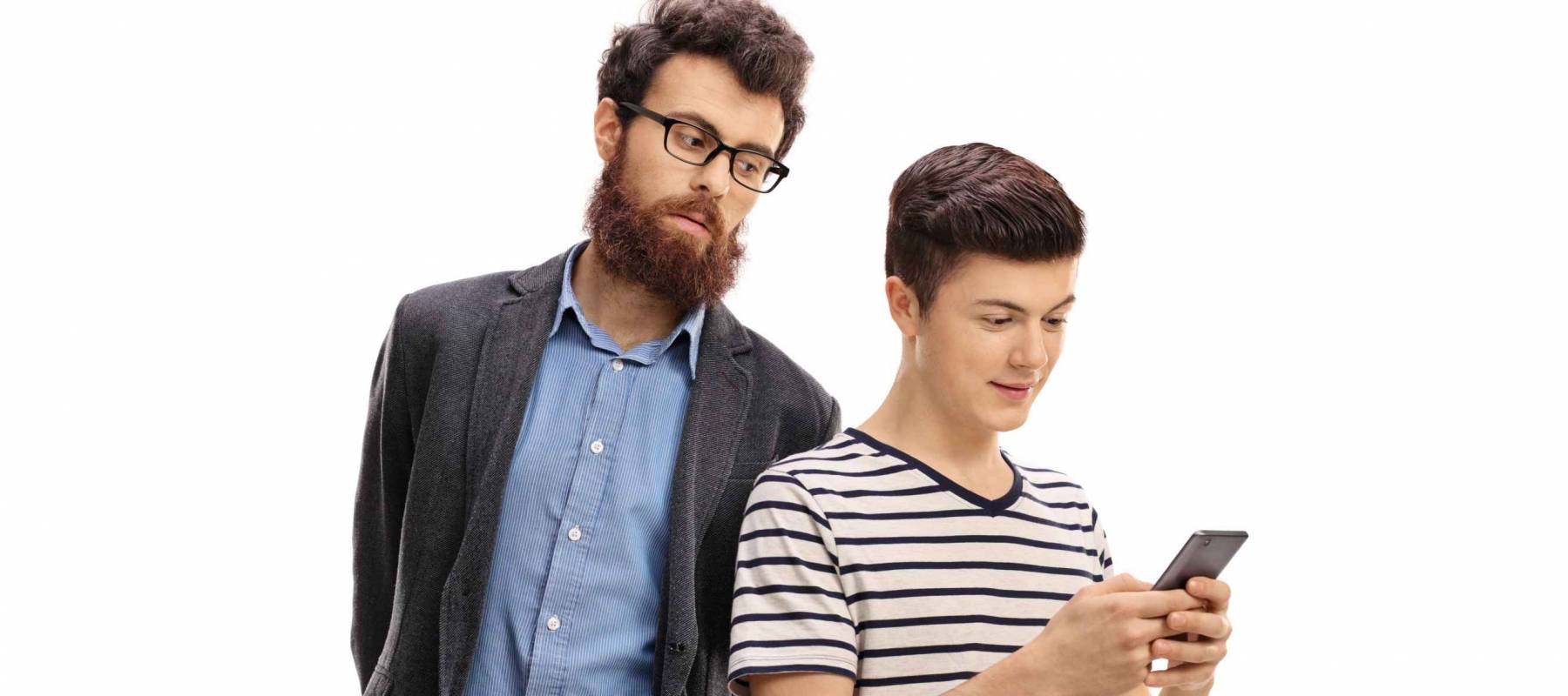 Concerned father peeking at the phone of his son isolated on white background