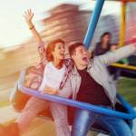 Beautiful, young couple having fun at an amusement park