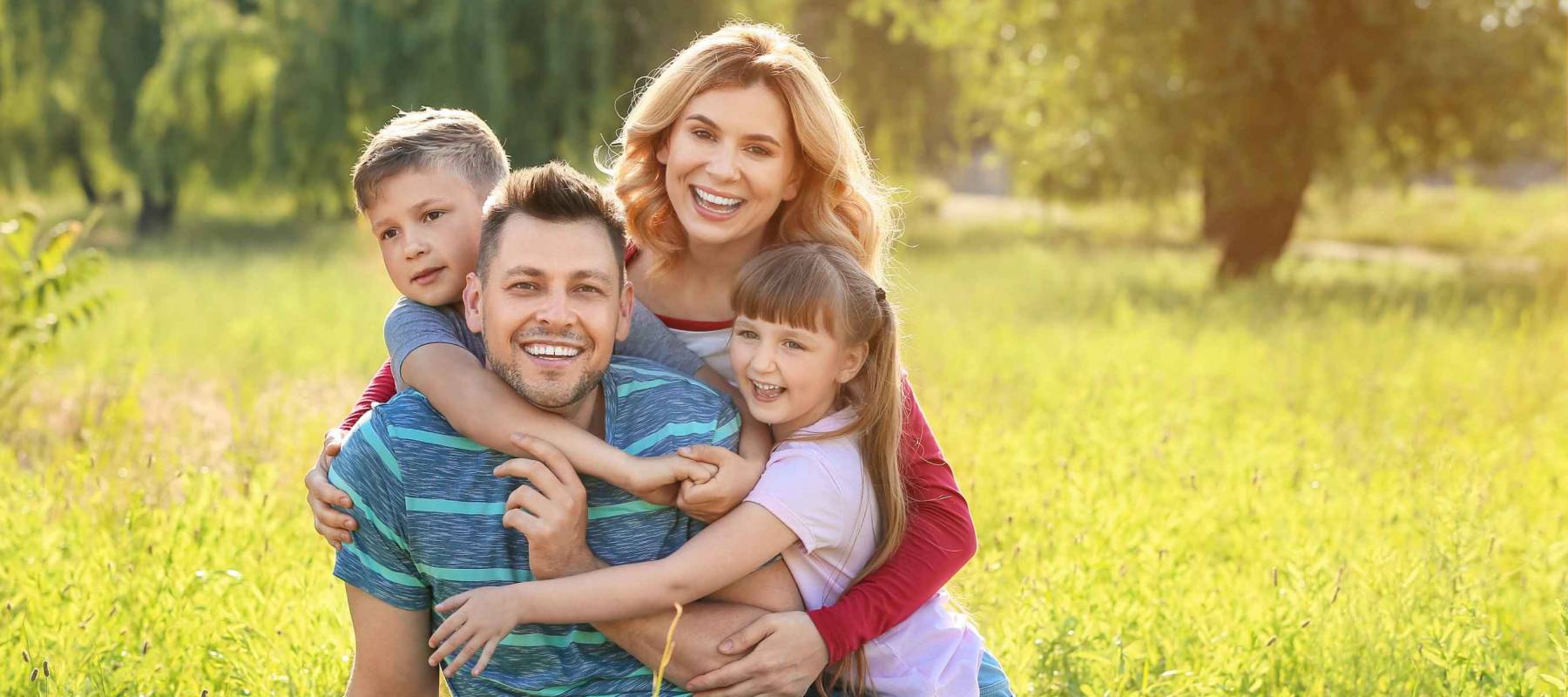 Happy family resting in park