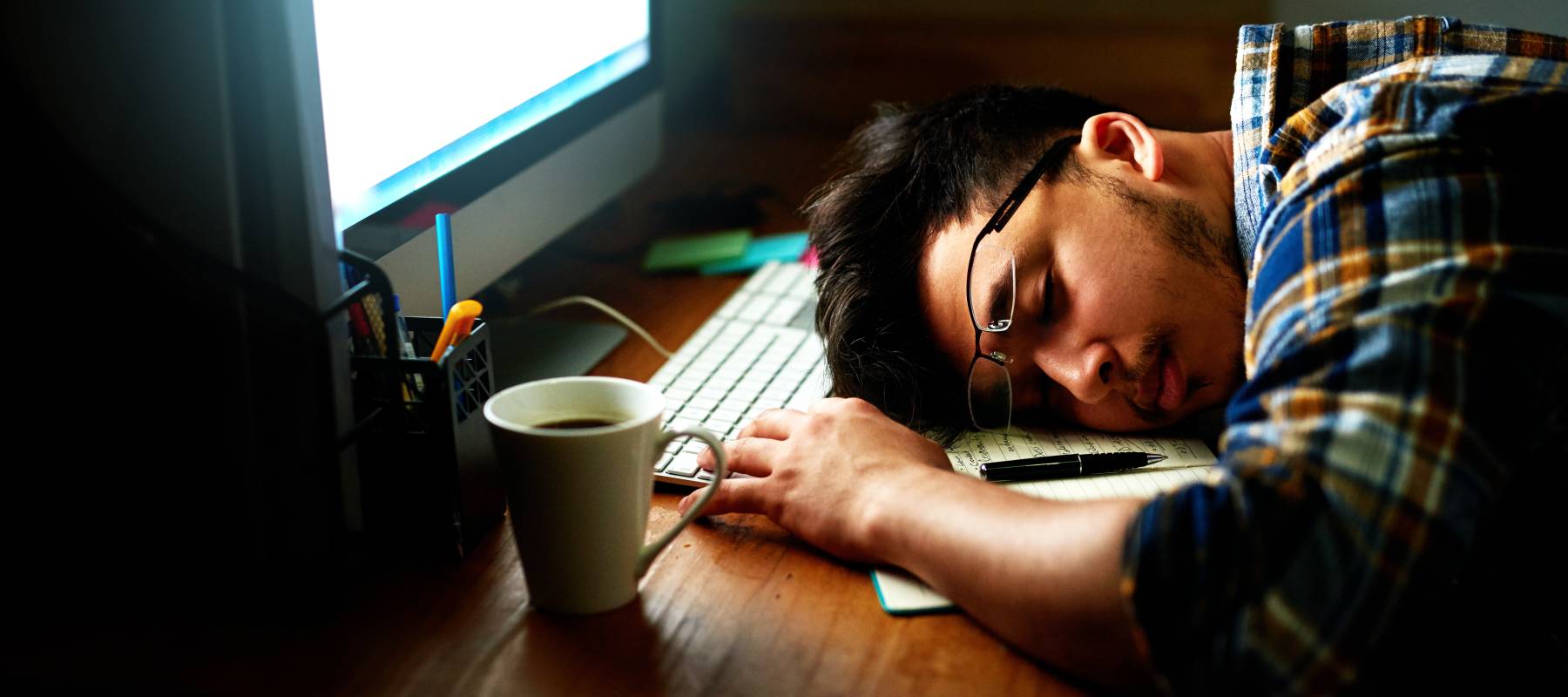 Man sleeping at his desk