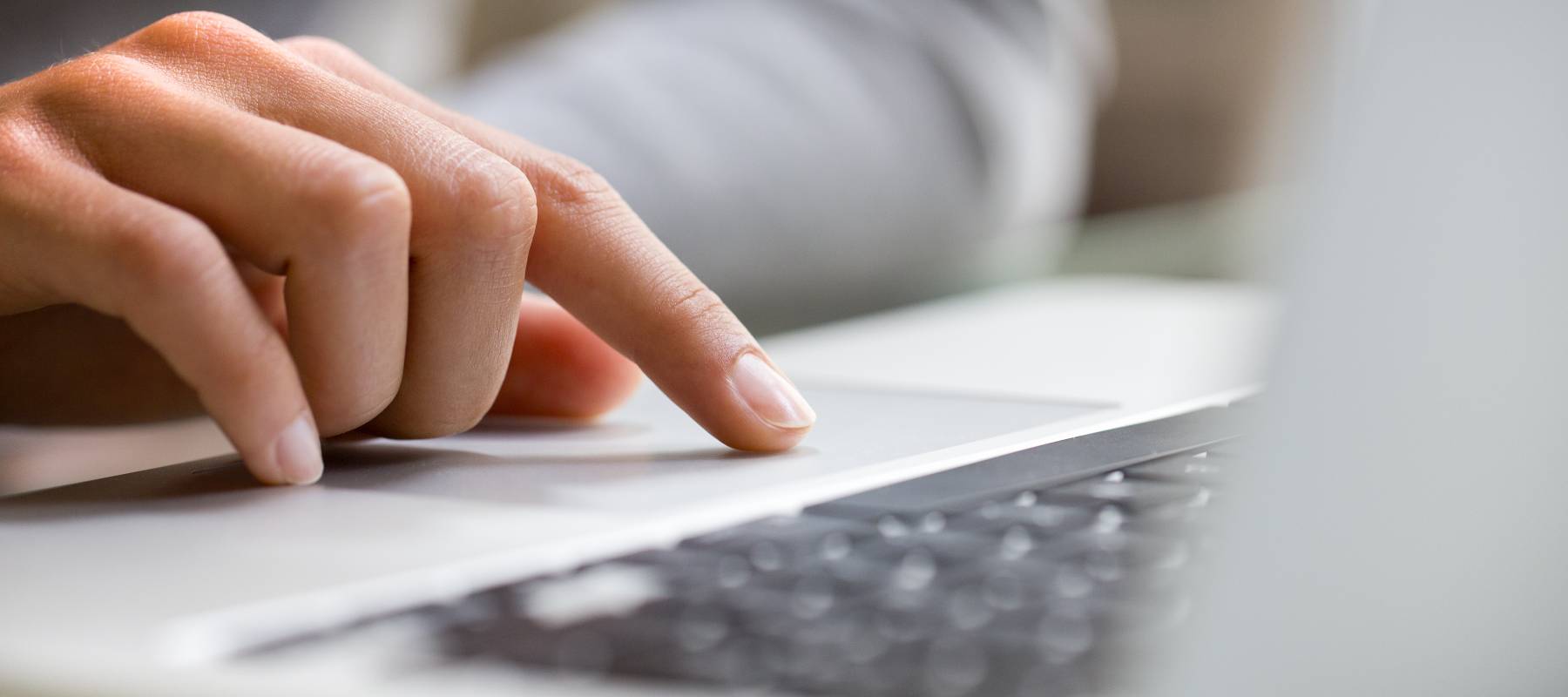 Hand using laptop