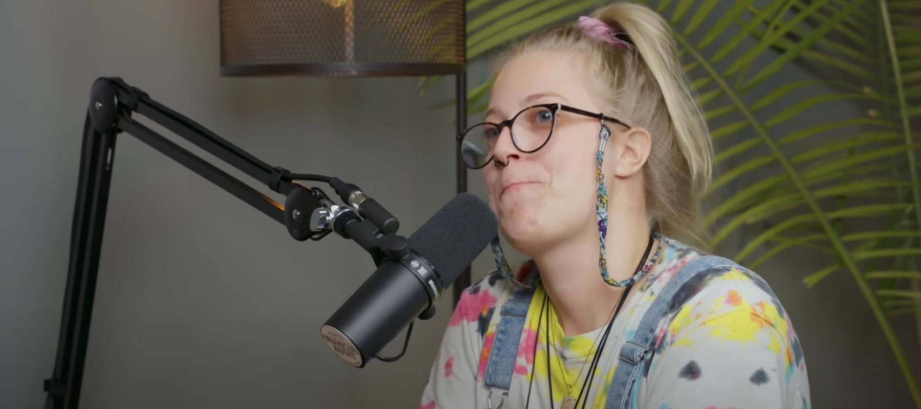 Woman talks about her financial situation on a podcast