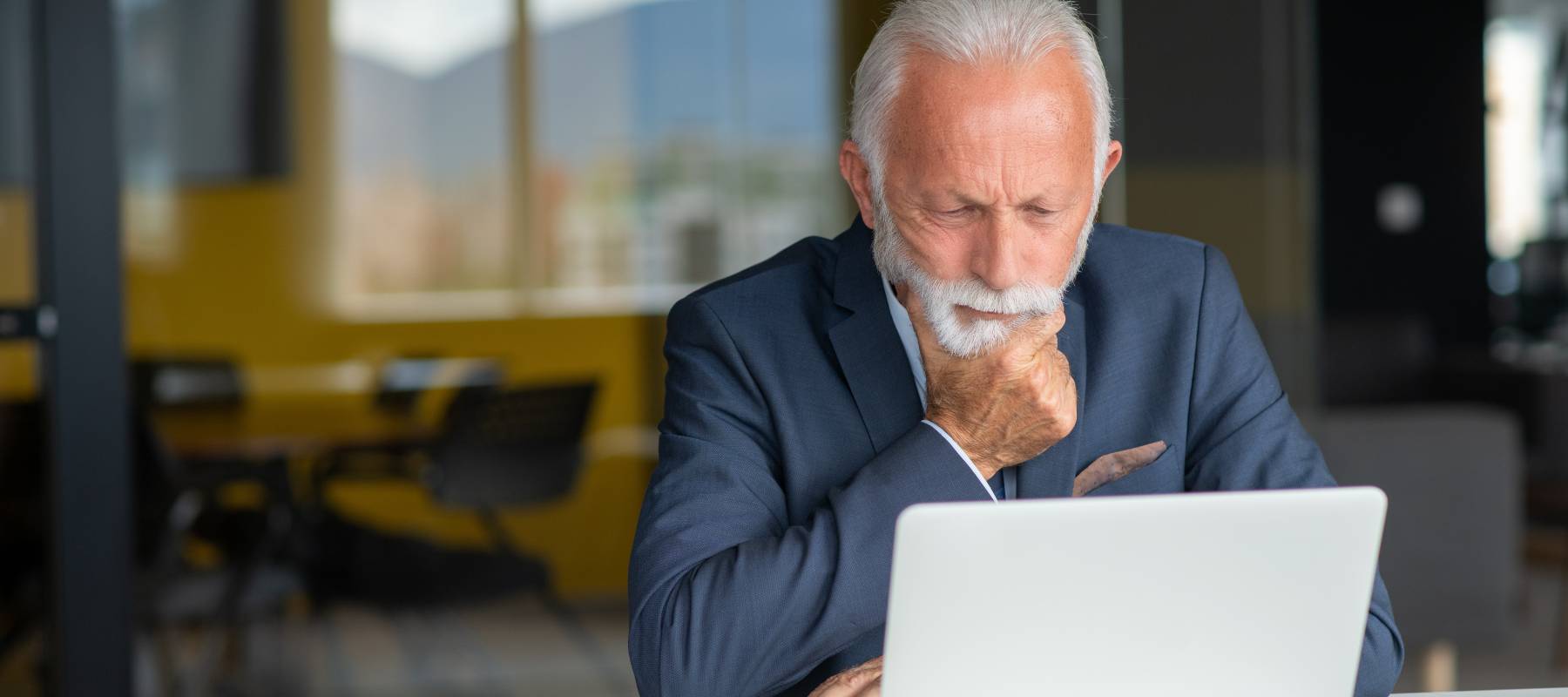 Man sitting at the computer thinking