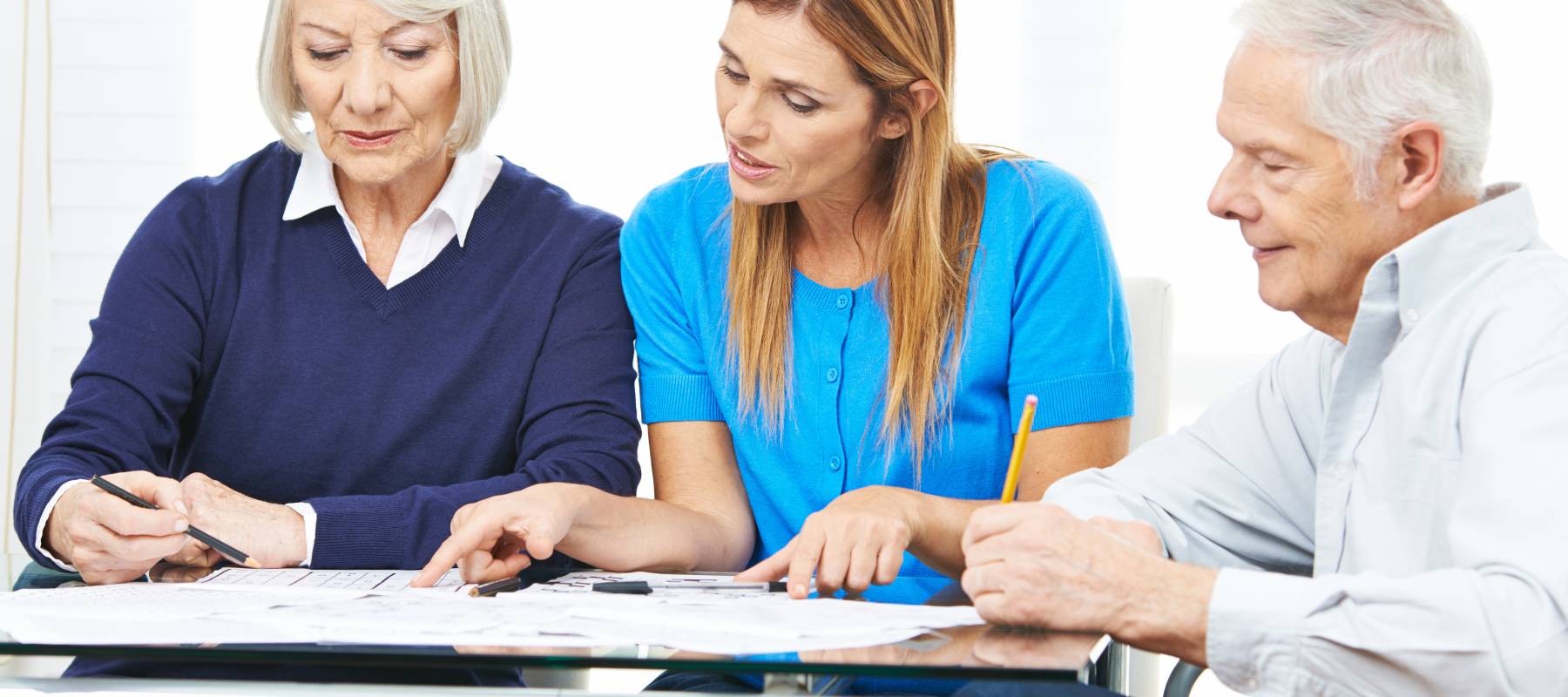 Woman consulting senior couple in nursing home