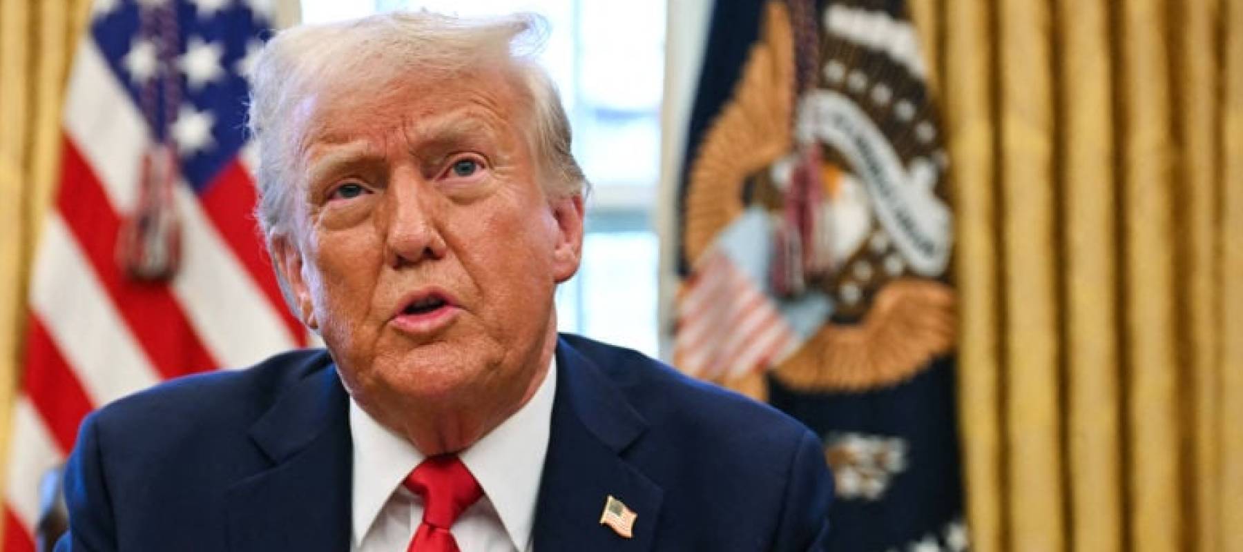 US President Donald Trump speaks to the press as he signs an executive order to create a US sovereign wealth fund, in the Oval Office of the White House.