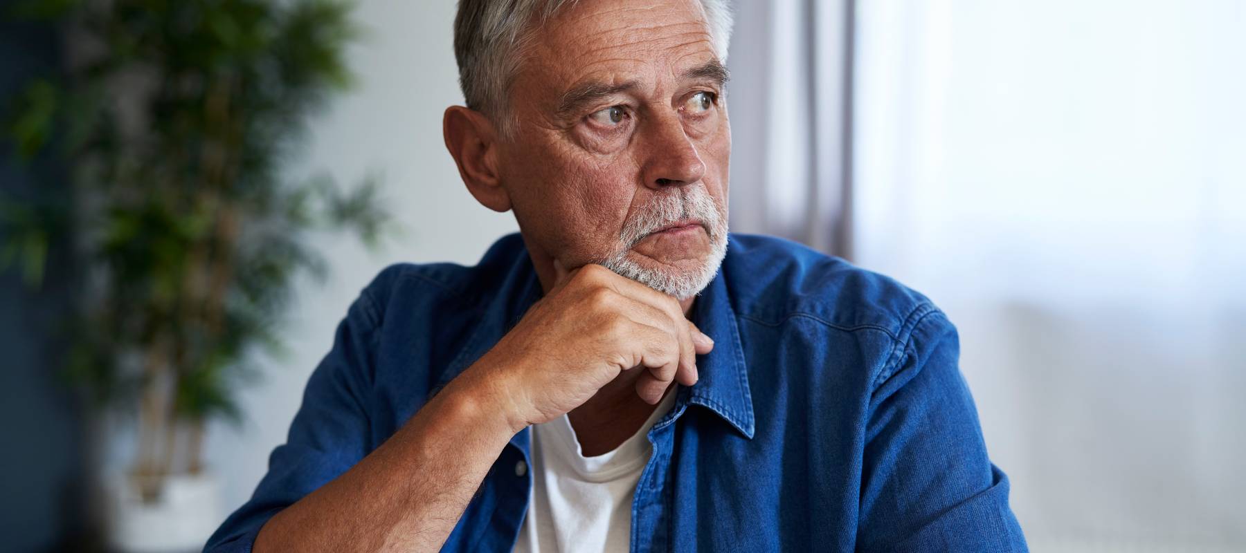 Concerned man looking at computer