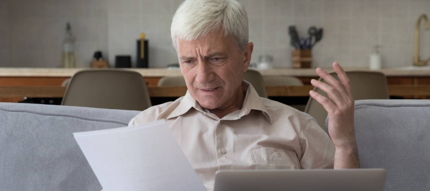 Frustrated man looking at bills