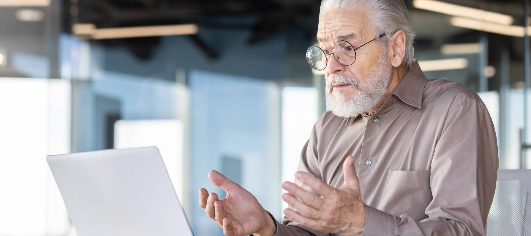 Man confused looking at a computer