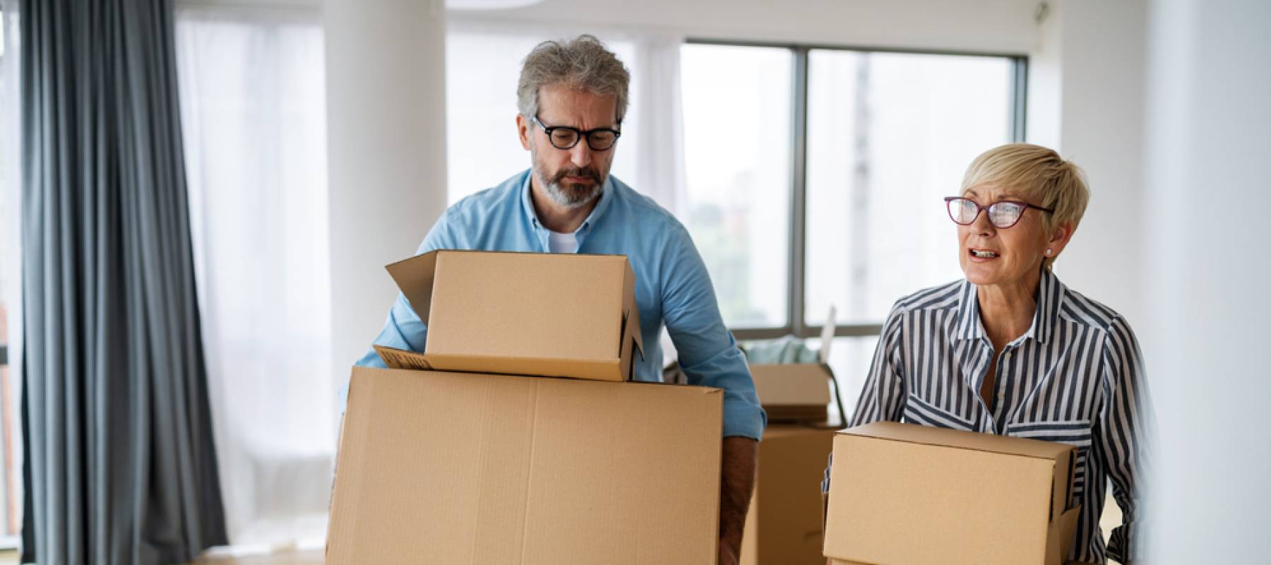 Couple with moving boxes