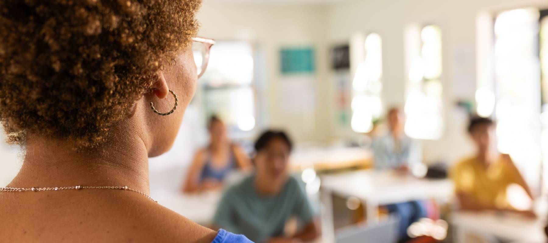 Woman looking at her students in a classroom