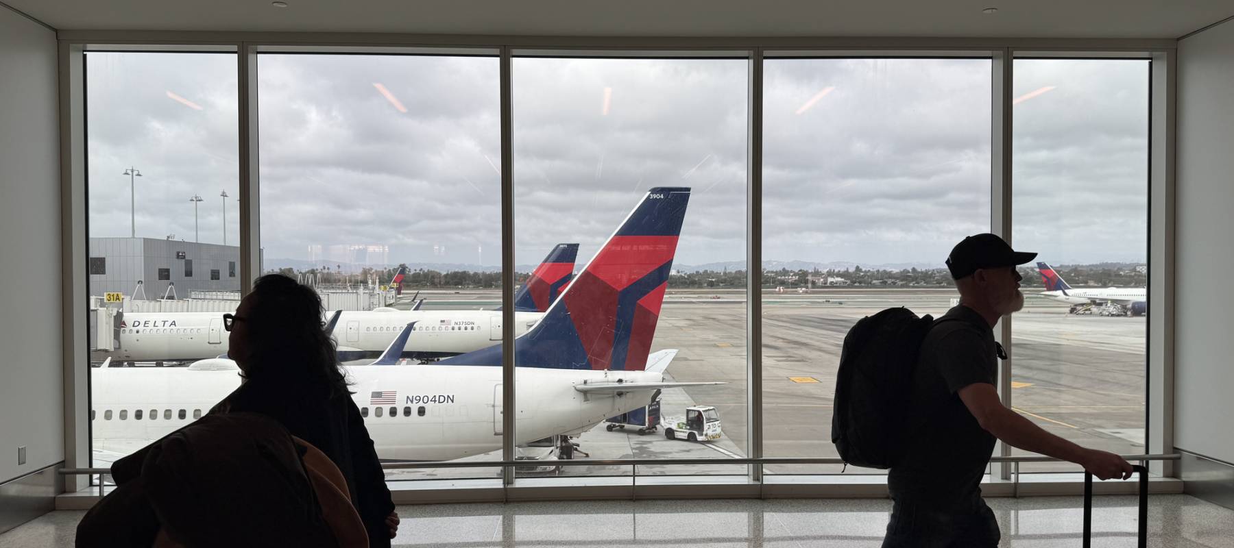 Passengers walking on the concourse of Delta's terminal 3 at Los Angeles International Airport