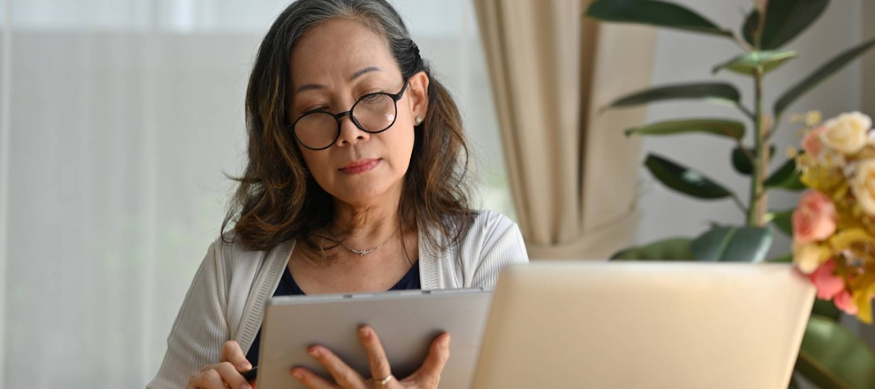 Woman looking at tablet.