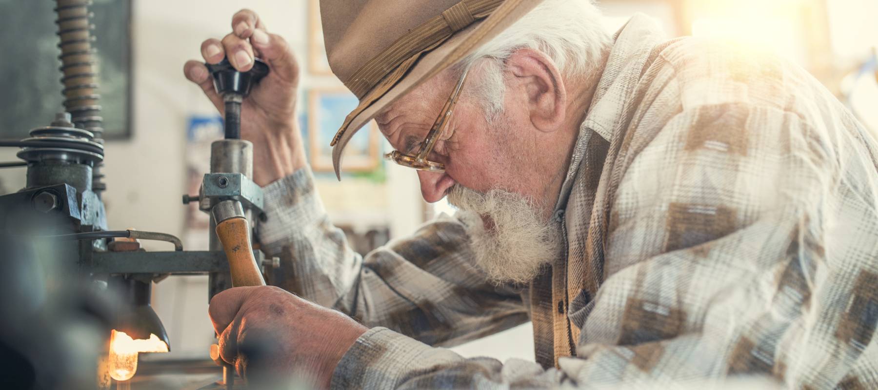 An old carpenter in his woodshop.