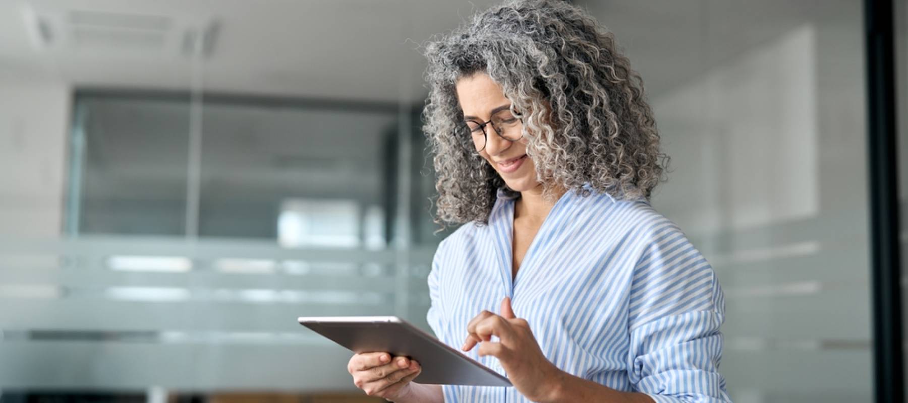 Woman looking at her tablet.