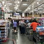 ELKRIDGE, MD, USA - APRIL 30, 2017: Costco Wholesale showing a large influx of shoppers, creating a checkout line that stretches halfway back though the store.
