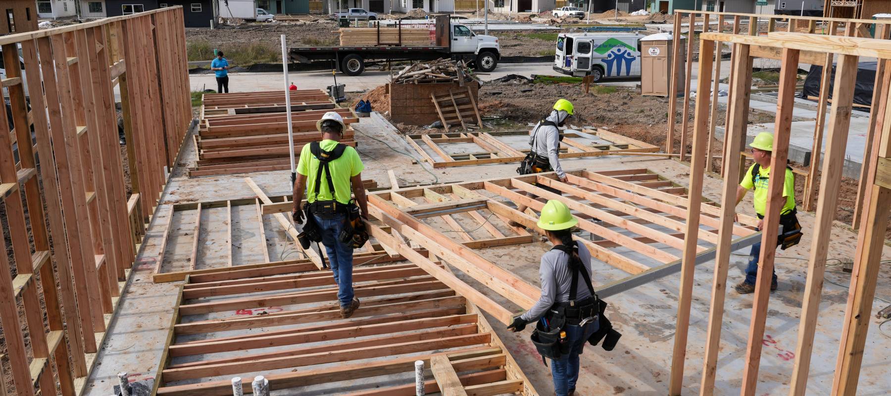 A group of workers construct a house at a Habitat for Humanity site in Houston, Texas, Dec. 16, 2024.