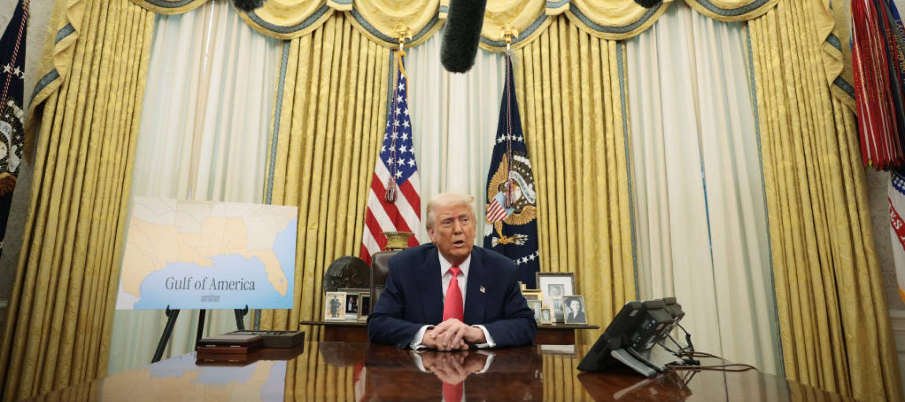 Donald Trump speaks as he signs executive orders in the Oval Office of the White House.