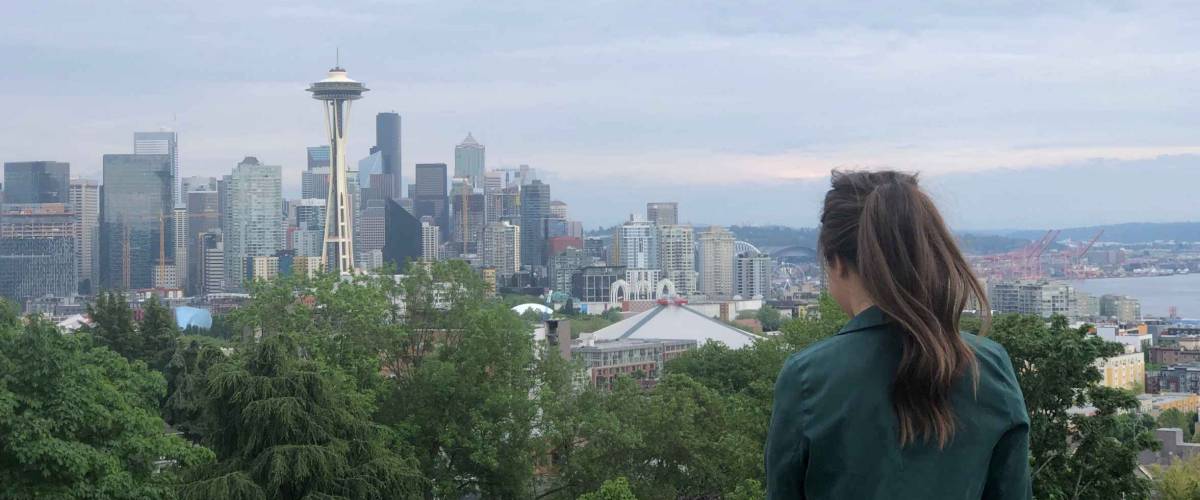 Woman with ponytail overlooking Seattle skyline from Kerry Park